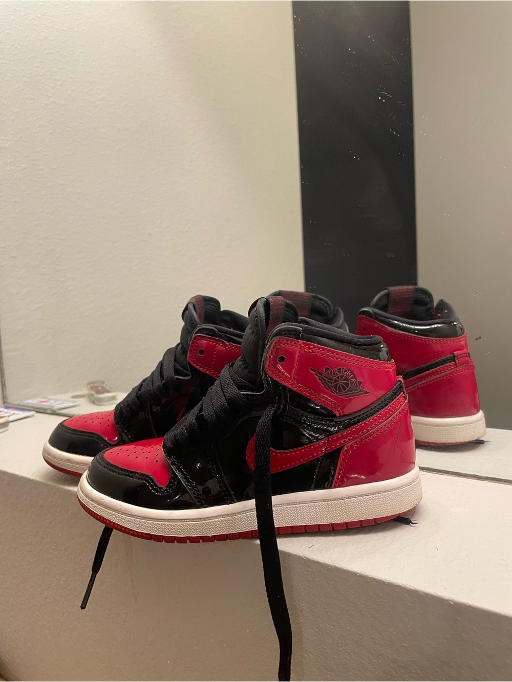 Air Jordan 1s Kids Red and Black High-Top Sneakers